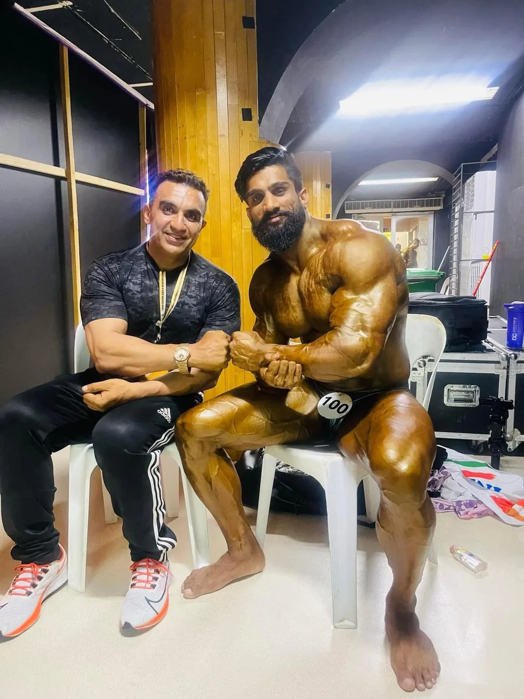 Coach and athlete backstage before walking out